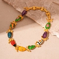 Bracciale vintage dorato con uova in smalto colorato e pendenti a forma di insetto - Collana Multicolore