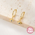 Detailed macro view of S925 sterling silver evil eye earrings with blue zircon in gold finish - KE22361 Classic Evil Eye Hoop / Gold