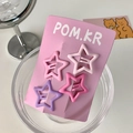Cute star-shaped hair clips in pink and purple shades on a branded card - Pentagram