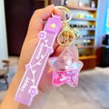 Pink star-shaped liquid glitter keychain with miniature unicorn and Happy Moments strap - Purple-Star Unicorn