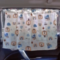 Beige car sunshade for kids with cartoon lion and rainbow patterns in a vehicle - Rainbow Lion King