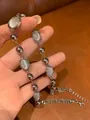 Silver-tone chain necklace featuring round metal beads and faux cat eye stone details - Metal Cat's Eye Ball Necklace
