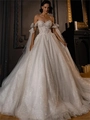 Detailed close-up of glittering sequin fabric and lace floral appliques on white wedding dress - US 2 / White