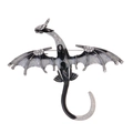 Macro detail of the dragon brooch showing silver base with enamel and white rhinestones - Black and White Gradient