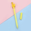 Simpatica penna gel dinosauro giallo con cappuccio 3D su sfondo rosa e blu - 0.5mm / Giallo