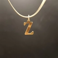 Elegant gold snake chain necklace featuring a polished uppercase letter Z pendant - Letter Z (5592272000746)