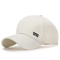 Minimalist beige cotton baseball cap with DYJ embroidery seen from 45-degree angle - Light Beige