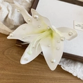 Detailed view of an elegant white fabric flower hair clip with exquisite pearl decorations - Lily Duckbill Clip / White (Single)