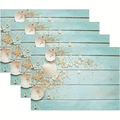 Detailed view of 4 blue ocean placemats with shell patterns and wood grain texture - Blue Wood Shells