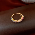 Macro shot of 18k gold plated open ring featuring multi-colored zircon stones - Adjustable / Gold/Multicolor