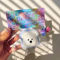 Pinch Family soft white bear bread squishy toy in a sealed transparent plastic bag - West Highland Toast