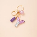 Detail of purple glitter resin letter Y keychain with purple tassel and gold hardware - Letter Y