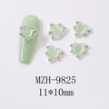 Macro view of heart cat-eye nail art charms with silver rhinestones and 11x10mm size - Heart Shape Cat Eye Stone Silver Frame Style (9825)