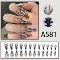 Detail view of long coffin press-on nails featuring a corset lace-up design with 24 pieces - White Base Black Lace-up (A581)