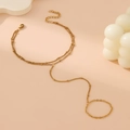 Elegantes goldfarbenes zweilagiges Fingerarmband mit Perlen und Ring auf orangefarbenem Grund - Gold Handkette Stil B (Einfache Kette)