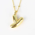 Detailed view of the gold letter Y pendant featuring a polished metallic finish and chain - Letter Y