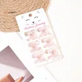Detailed view of six pink glitter butterfly hair clips on a white display card - Glitter Pink