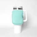 Detail of mint green zipper pouch attached to a 40oz white insulated tumbler cup - Single Pocket Light Blue