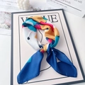 Detail of colorful abstract print satin scarf knotted on a fashion magazine - Navy Color Block