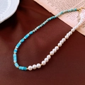 Detail of vintage necklace with blue faceted beads and white pearls on brown fabric - Blue Beaded Spliced Style / Gold Blue White