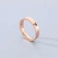 Macro shot of rose gold hammered texture titanium steel ring with unique metal reflections - Rose Gold (4mm)