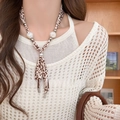 Close-up of leopard print silk scarf necklace with baroque pearls on a model - 7# Necklace-Coffee