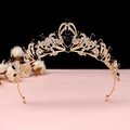 Macro shot of gold baroque crown with black teardrop gems and white rhinestones - No.1 KC Gold (Black Stone)