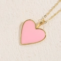 Elegant 14K gold plated heart necklace with soft pink enamel inlay on stone surface - Pink Heart