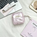 Detailed flat lay of a pink quilted bow cosmetic bag with chic lifestyle accessories - PU Quilted Bow Pink