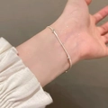 Close-up of a minimalist silver bead bracelet worn on a wrist for a sleek style - Ultra Fine Chain Double Round Bead Bracelet (MY36838)