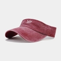 Detailed close-up of retro red sun visor hat featuring white crown embroidery and washed cotton - Adjustable / Burgundy