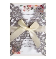 Detail of silver glitter laser cut invitation with beige ribbon bow for weddings - Dark Gray