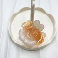 Gradient orange and white floral claw clip with a glossy finish on a cloud tray - Orange (Transparent Rose)