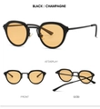 Détails de lunettes de soleil ovales rétro avec monture noire et verres champagne - Monture Noire Verres Jaunes