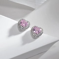 Detailed view of heart-shaped pink ruby stud earrings with white zircon halo on white background - Heart Shape Pink Zirconia Studs