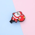 Cartoon Santa Claus hair clip made of soft rubber on a colorful split background - Santa with Gift Bag