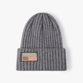 Grey ribbed knit beanie with a decorative fabric patch for winter outdoor warmth - One Size / Dark Gray