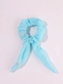 Detail of light blue LED scrunchie with bow tails made of soft fabric on white background - Blue Rabbit Ear with LED
