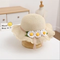 Close-up of woven straw sun hat for girls with pink lace and white daisy decorations - Single Hat / Beige