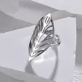 Detail of silver hollow leaf ring with intricate textures on white marble stand - Hollow Leaf / Silver