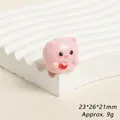 Detailed close-up of a cute pink resin pig figurine holding a tea cup with size dimensions - Tea Time Pink Pig