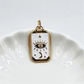 Detail of gold rectangular tarot pendant with eye and moon motifs on white shell plate - White Evil Eye Pendant / Pendant Only