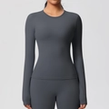 Detail of dark grey long sleeve yoga top featuring tight fit and premium stitching quality - Graphite Grey