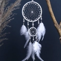 Elegant white double ring dream catcher with delicate feathers and pearls on blue background - White