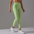 Dettaglio dei leggings da yoga a vita alta verde petrolio con controllo pancia senza cuciture - XS / Verde Scuro