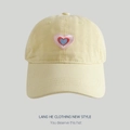 Creamy yellow washed cotton baseball cap featuring a tricolor heart embroidery - Pale Yellow