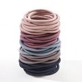 Elastic fabric hair ties in assorted pastel colors stacked in a neat vertical pile - High Elasticity / Morandi Color