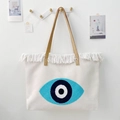 Boho-Canvas-Tragetasche mit Evil-Eye-Stickerei und dekorativem weißem Fransenbesatz - Böser Blick Muster