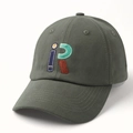 Detailed view of dark green baseball cap with high-quality colorful iR letter embroidery - Adjustable / Gray