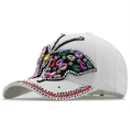 White denim baseball cap with colorful rhinestone butterfly and crystal brim detail - White